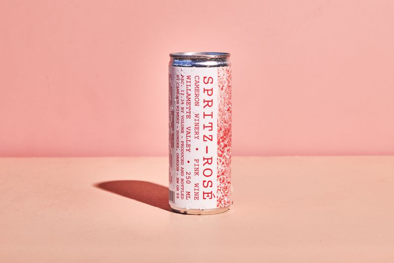 Aluminum can with pink writing on the side that says “spritz-rose.”