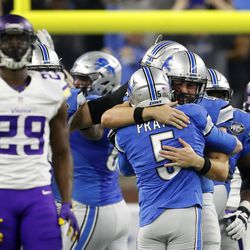 Detroit Lions kicker Matt Prater (5) is congratulated after making a 40-yard winning field goal during the second half of an NFL football game against the Minnesota Vikings, Thursday, Nov. 24, 2016, in Detroit. 
