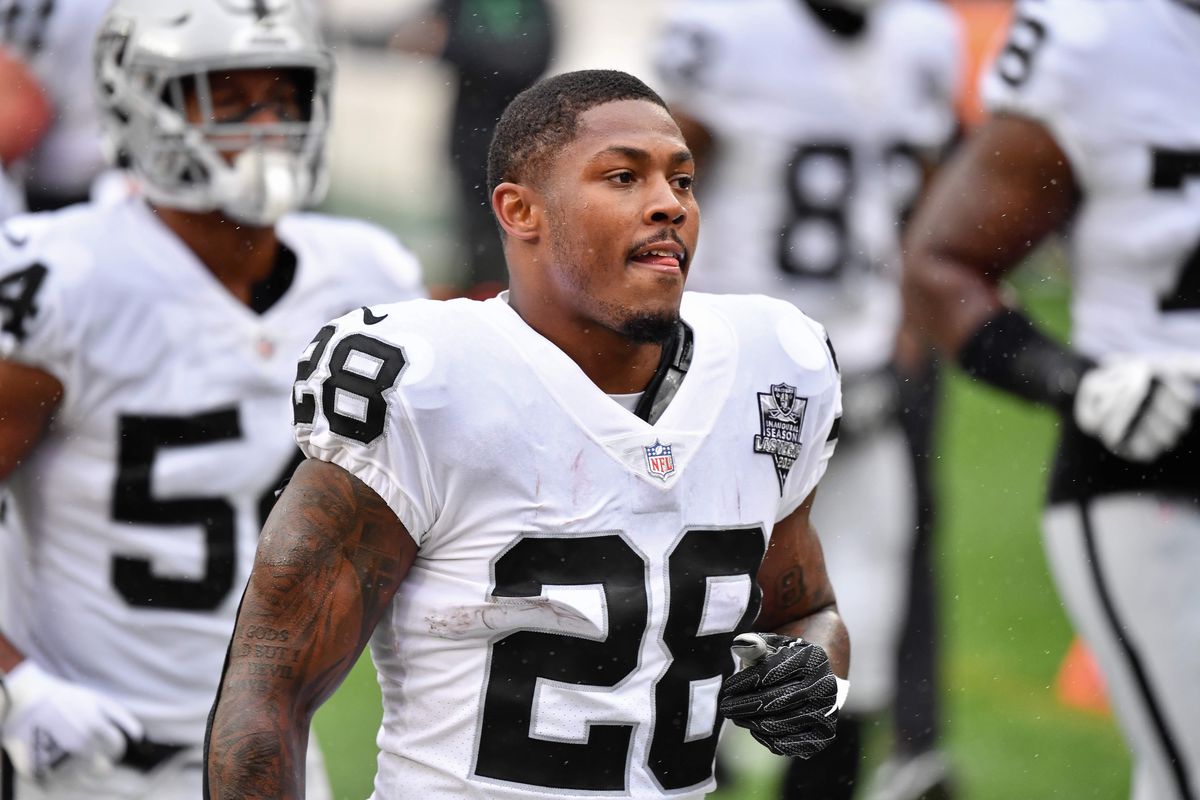 Josh Jacobs #28 of the Las Vegas Raiders runs off the field after pregame warmups before a game against the Cleveland Browns at FirstEnergy Stadium on November 1, 2020 in Cleveland, Ohio.