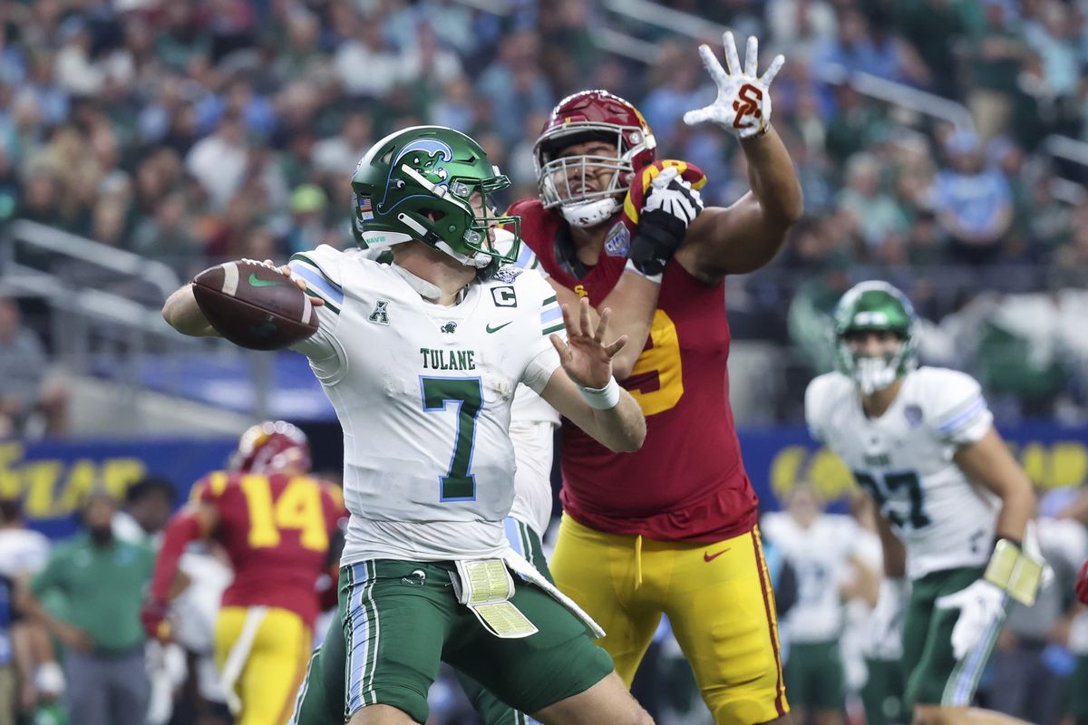Tulane Green Wave quarterback Michael Pratt throws a touchdown pass during the first half against the USC Trojans in the 2023 Cotton Bowl at AT&amp;T Stadium.