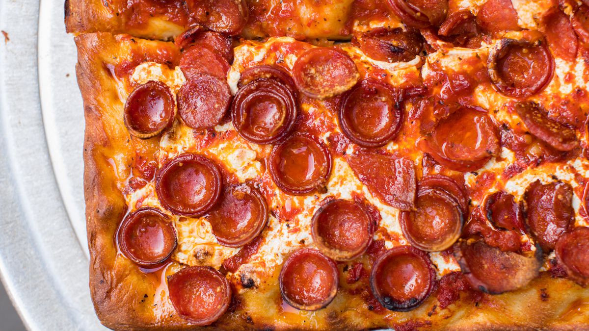 pepperoni pizza on a white plate