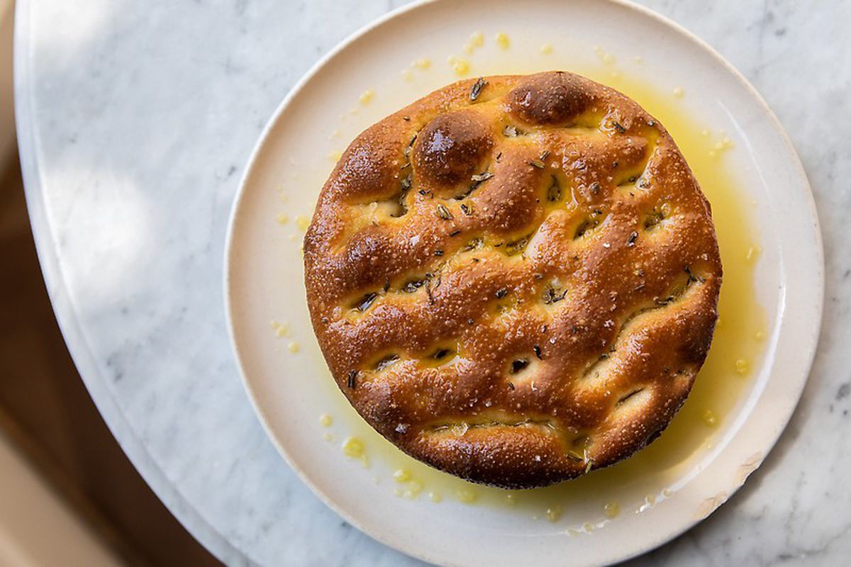 Topdown view of a round baked focaccia from Ben’s Bread