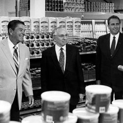LDS Church leaders President Thomas S. Monson, right, and President Gordon B. Hinckley, center, take a special tour of the Ogden Cannery welfare facility with U.S. President Ronald Reagan.