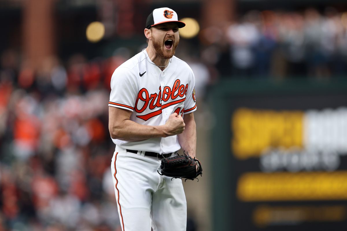 Bryan Baker of the Baltimore Orioles reacts after a strikeout for the third out in the eighth inning during the game between the New York Yankees and the Baltimore Orioles at Oriole Park at Camden Yards on Friday, April 7, 2023 in Baltimore, Pennsylvania.