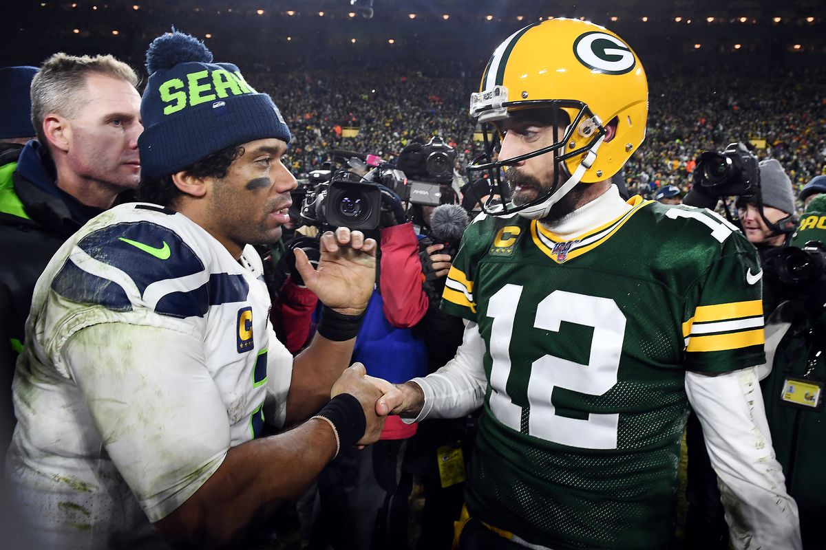 Russell Wilson #3 of the Seattle Seahawks greets Aaron Rodgers #12 of the Green Bay Packers after the Packers defeated the Seahawks 28-23 in the NFC Divisional Playoff game at Lambeau Field on January 12, 2020 in Green Bay, Wisconsin.