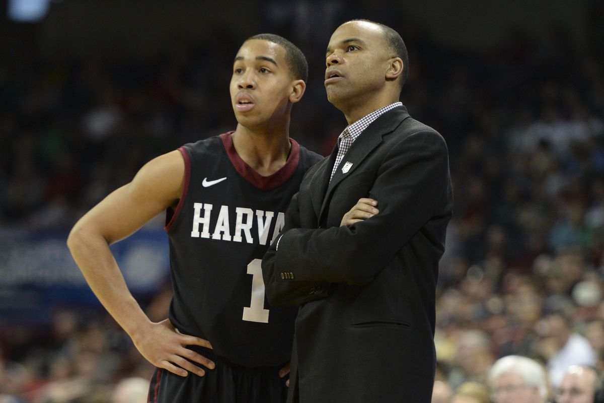 Mar 22, 2014; Spokane, WA, USA; Harvard Crimson head coach Tommy Amaker (right) talks to guard Siyani Chambers (1) against the Michigan State Spartans in the first half of a men's college basketball game during the third round of the 2014 NCAA Tourna