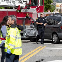Salt Lake police detective Greg Wilking checks on drivers involved in a car accident at 900 South and West Temple in Salt Lake City on Tuesday, May 7, 2019.