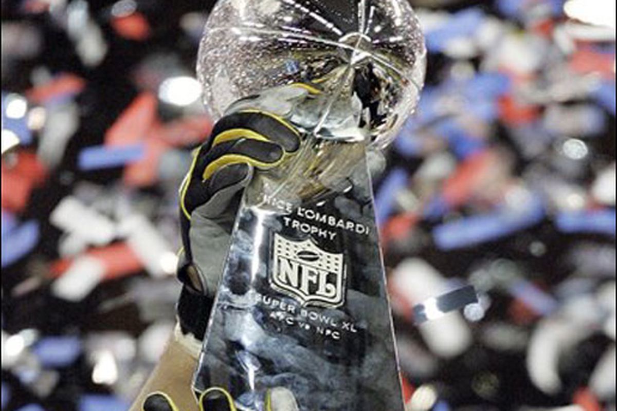The Lombardi Trophy showered by victorious confetti.