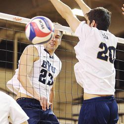BYU's Michael Hatch spikes the ball past CBU's Rohit Paul as BYU and Cal Baptist University play Saturday, Feb. 7, 2015, at BYU in the Smith Field House in Provo.