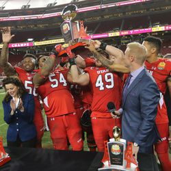 Utah celebrates its win over the Hoosiers in the Foster Farms Bowl in Santa Clara, California, on Wednesday, Dec. 28, 2016.