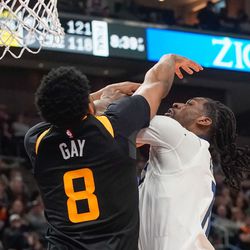 Utah Jazz forward Rudy Gay, left, blocks the shot of Minnesota Timberwolves center Naz Reid during an NBA game at Vivint Arena in Salt Lake City on Friday, Dec. 31, 2021.