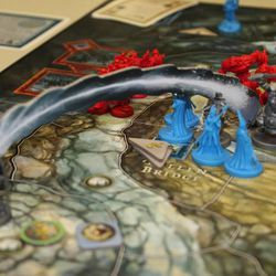 Gandalf the Grey can use a magical, ranged attack against the Shadow Army in The Battle of Five Armies, from Ares Games.