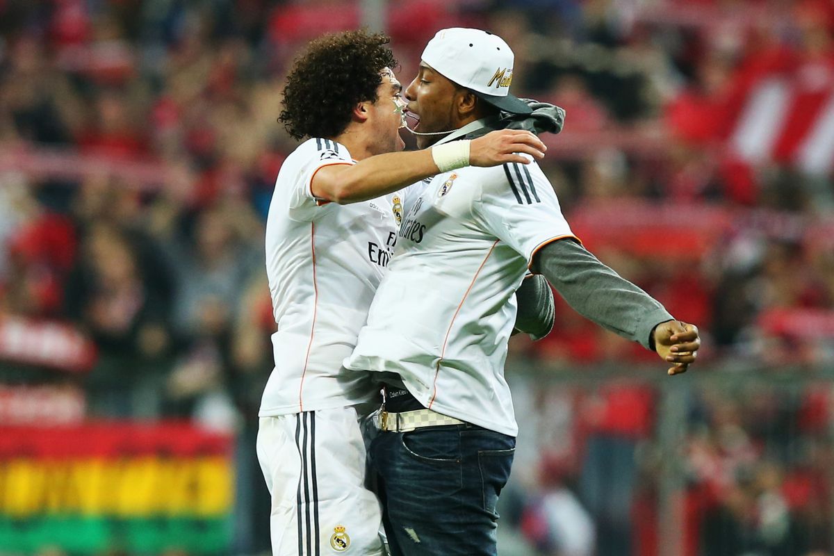 Pepe celebrates with Marcus Slaughter of Real Madrid's basketball team.