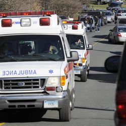 Ambulances leave an area near the scene of a shooting at the Sandy Hook Elementary School in Newtown, Conn., about 60 miles northeast of New York City, Friday, Dec. 14, 2012. An official with knowledge of Friday's shooting said 27 people were dead, including 18 children. 