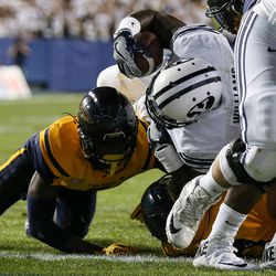 Brigham Young Cougars running back Jamaal Williams (21) dives in for a touchdown during a game at LaVell Edwards Stadium in Provo on Friday, Sept. 30, 2016.