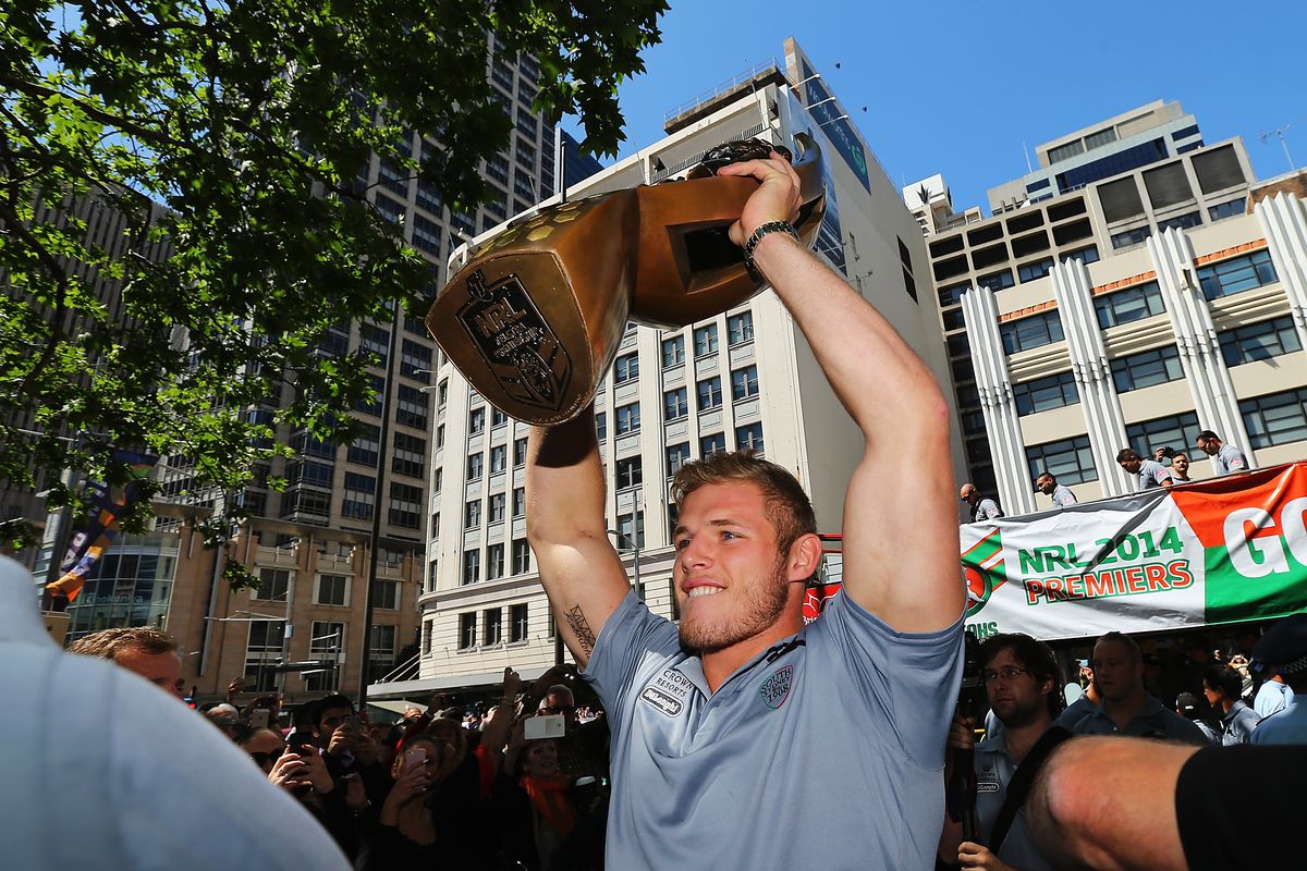 Thomas Burgess celebrates a rugby title in 2014
