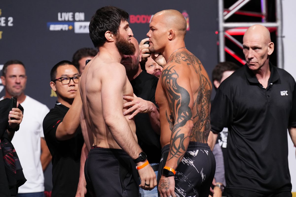 (L-R) Magomed Ankalaev of Russia and Anthony Smith face off during the UFC 277 ceremonial weigh-in at American Airlines Center on July 29, 2022 in Dallas, Texas.