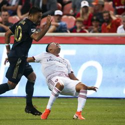 Real Salt Lake midfielder Sebastian Saucedo (23) hits the ground after colliding with Philadelphia Union midfielder Marco Fabian (10) during the first half of a game at Rio Tinto Stadium in Sandy on Saturday, July 13, 2019.