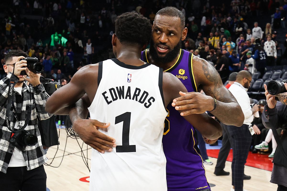 Minnesota Timberwolves guard Anthony Edwards (1) and Los Angeles Lakers forward LeBron James (6) hug after the game at Target Center.