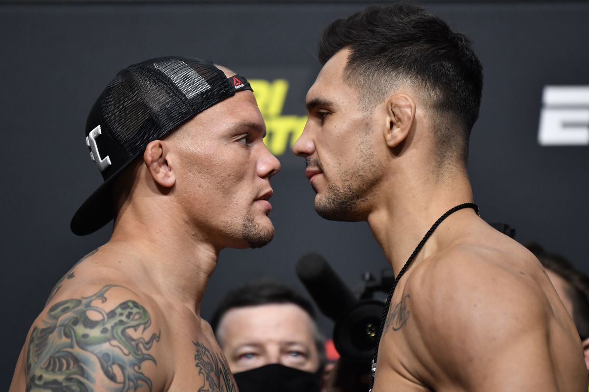 Opponents Anthony Smith and Aleksandar Rakic of Austria face off during the UFC Fight Night weigh-in at UFC APEX on August 28, 2020 in Las Vegas, Nevada.