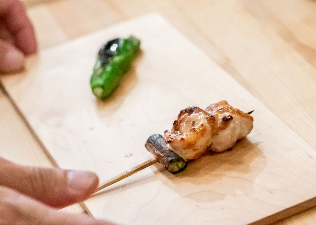 A chicken skewer and pepper