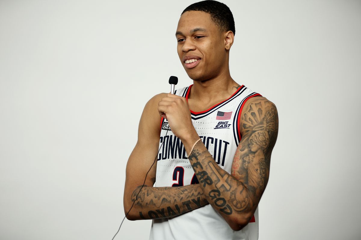 Jordan Hawkins of the Connecticut Huskies smiles during media availability for the Final Four as part of the NCAA Men’s Basketball Tournament at NRG Stadium on March 30, 2023 in Houston, Texas.