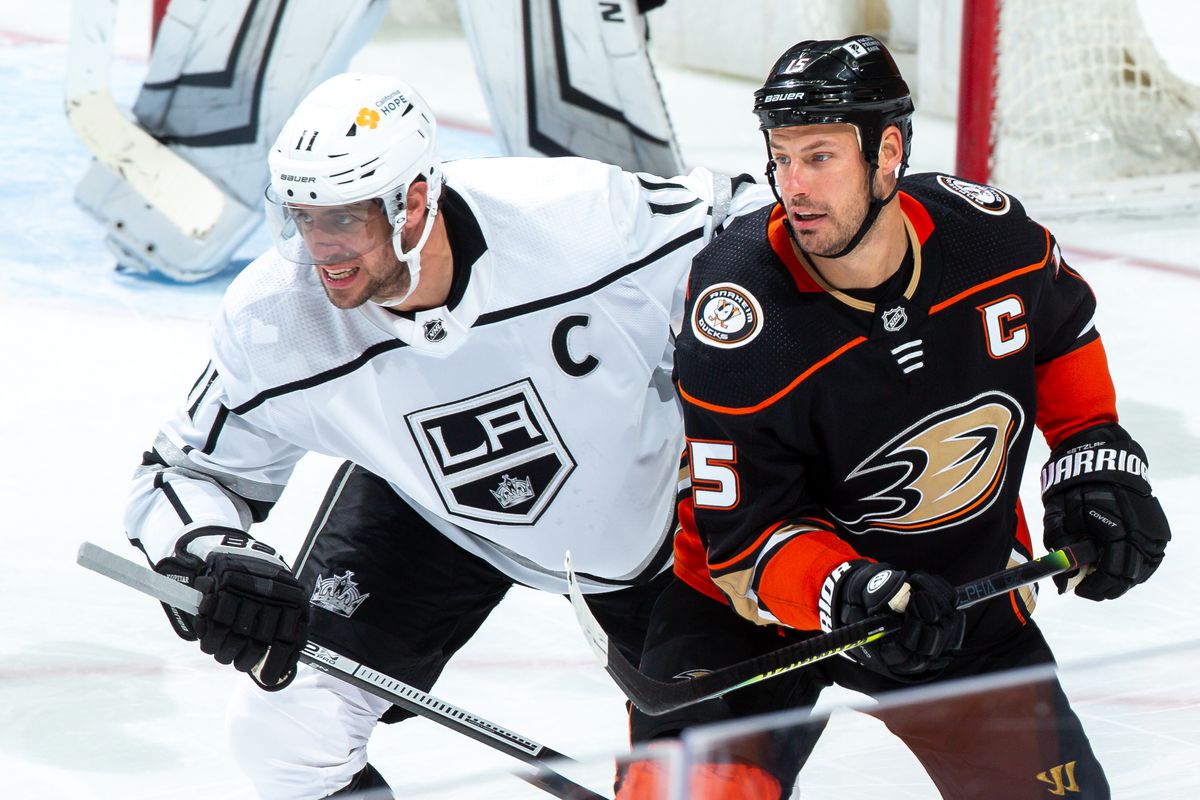 Anze Kopitar #11 of the Los Angeles Kings and Ryan Getzlaf #15 of the Anaheim Ducks battle for position during the third period of the game at Honda Center on March 10, 2021 in Anaheim, California.