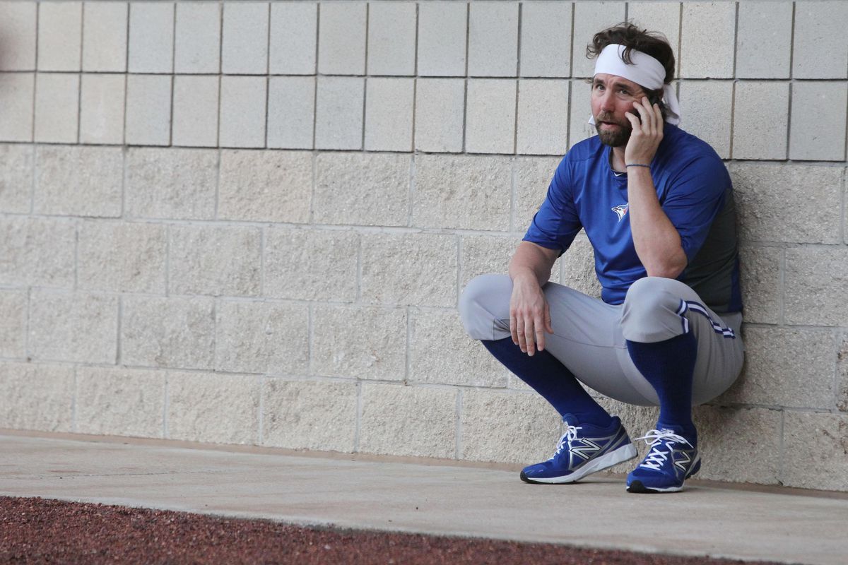 This photo is completely unrelated to the article. But it's OK because R.A. Dickey is talking on his cell phone.