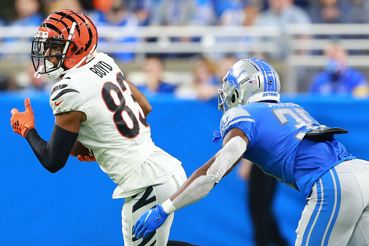 Tyler Boyd #83 of the Cincinnati Bengals runs with the ball against Jerry Jacobs #39 of the Detroit Lions during the first half at Ford Field on October 17, 2021 in Detroit, Michigan.