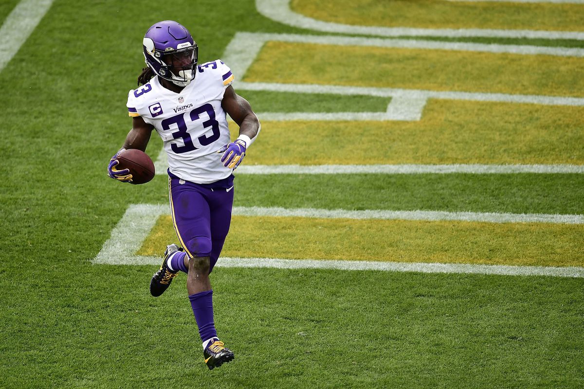 Dalvin Cook #33 of the Minnesota Vikings rushes for a touchdown during a game against the Green Bay Packers at Lambeau Field on November 01, 2020 in Green Bay, Wisconsin.