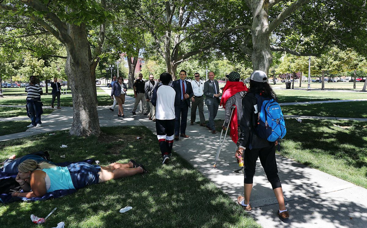 Lt. Gov. Spencer Cox, third from right, tours Pioneer Park in the Rio Grande area of Salt Lake City on Monday, June 25, 2018.