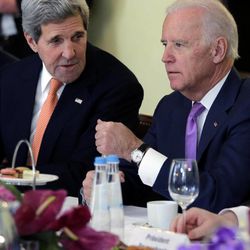 U.S. Secretary of State John Kerry, left, talks to U.S. Vice President Joe Biden prior to a meeting with Ukraine's  President Petro Poroshenko during the 51.  Munich Security Conference in Munich, Germany, Saturday, Feb. 7, 2015. The conference on security policy takes place from Feb. 6, 2015 until Feb. 8, 2015. 