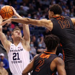Brigham Young Cougars guard Trevin Knell (21) goes up for a shot with Pacific Tigers forward Jeremiah Bailey (13) defending as BYU and Pacific play in an NCAA basketball game in Provo at the Marriott Center on Thursday, Jan. 6, 2022. BYU won 73-51.