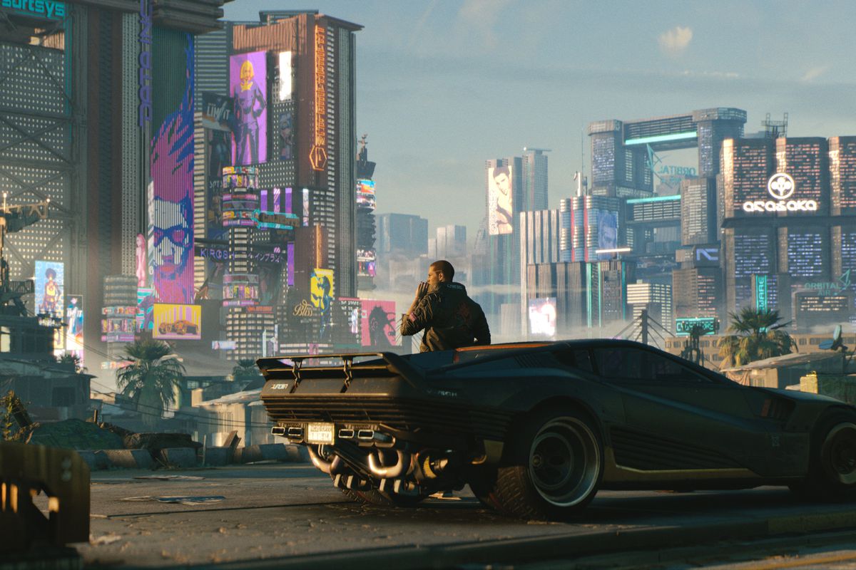 Key art of V, the protagonist of Cyberpunk 2077, leaning against a car and staring at the skyline of Night City in Cyberpunk 2077.