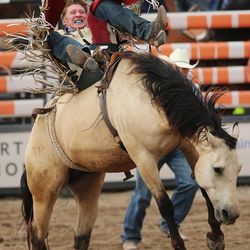Ty Breuer rides bareback during the Days of '47 Rodeo in Salt Lake City on Thursday, July 20, 2017.