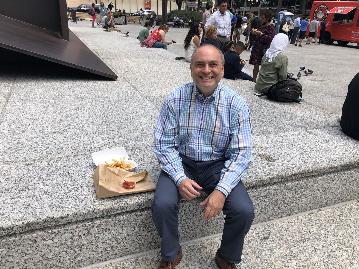 Jeff Singer is enjoying fried prawns at Daley Plaza on Friday