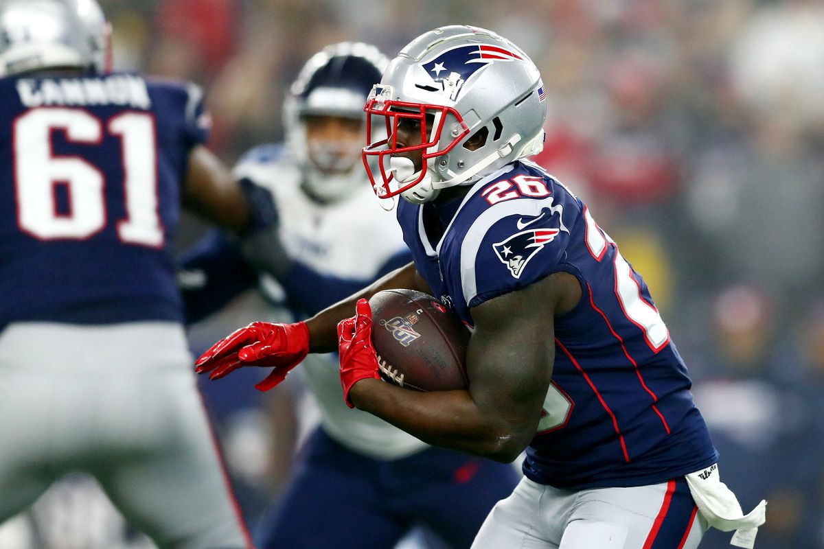 Sony Michel of the New England Patriots carries the ball in the AFC Wild Card Playoff game against the Tennessee Titans at Gillette Stadium on January 04, 2020 in Foxborough, Massachusetts.
