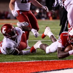 Utah Utes quarterback Tyler Huntley (1) dives in to the end zone on a 15-yard run, putting the Utes up 21-13 over the Washington State Cougars after the PAT, at Rice-Eccles Stadium in Salt Lake City on Saturday, Sept. 28, 2019.