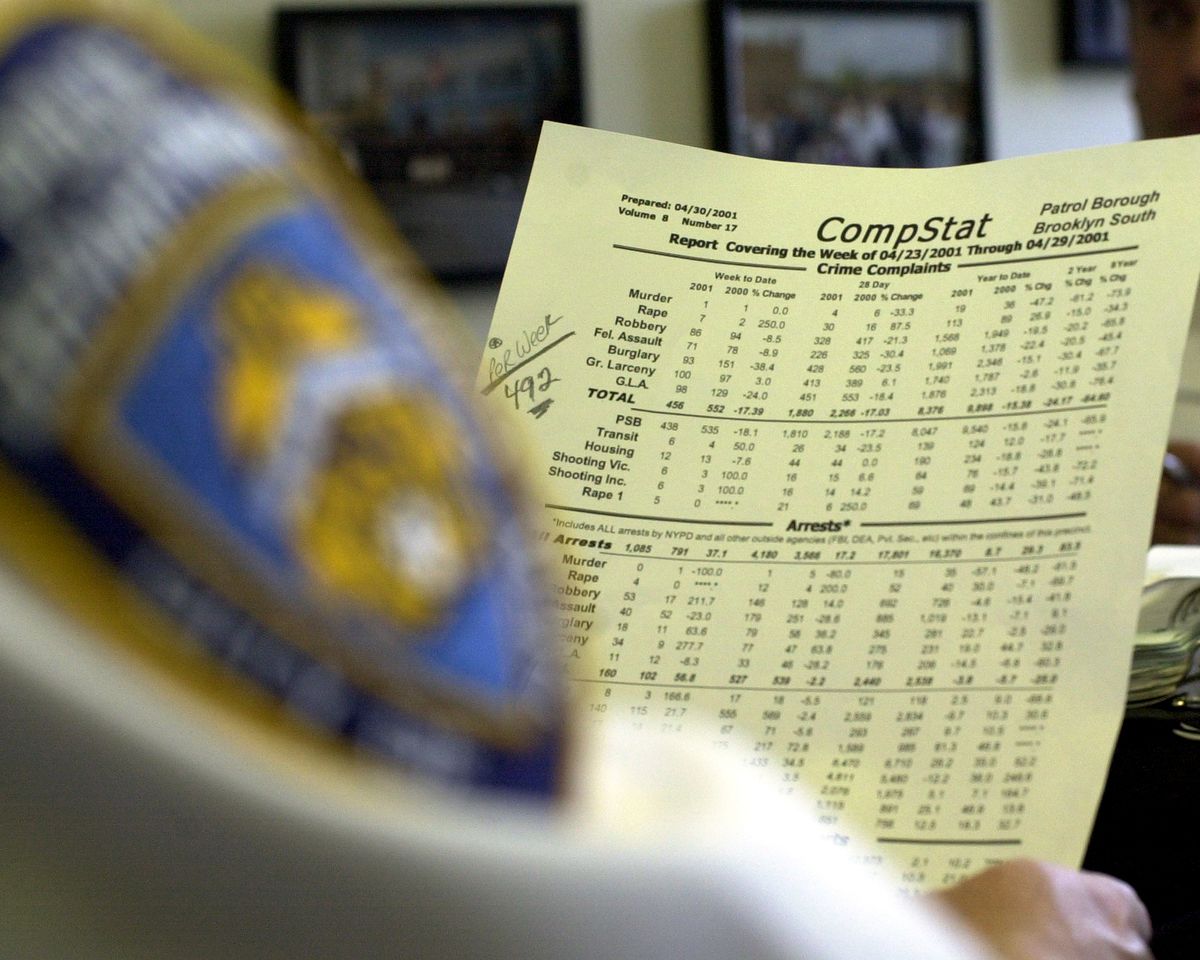 A police officer reviews CompStat data.