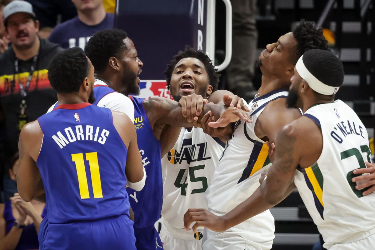 Denver Nuggets forward JaMychal Green (0) and Utah Jazz center Hassan Whiteside (21) gets into a scuffle during the game at Vivint Arena in Salt Lake City on Tuesday, Oct. 26, 2021. Both received technical fouls and were ejected from the game.