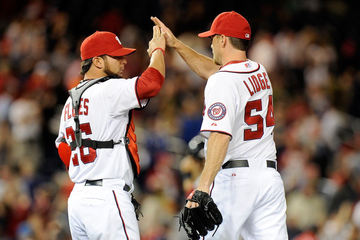 WASHINGTON, DC - APRIL 17:  Brad Lidge #53 of the Washington Nationals celebrates with Jesus Flores #26 after a 1-0 victory against the Houston Astros at Nationals Park on April 17, 2012 in Washington, DC.  (Photo by Greg Fiume/Getty Images)
