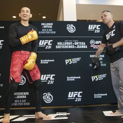 Max Holloway salutes crowd at UFC 231 workouts.