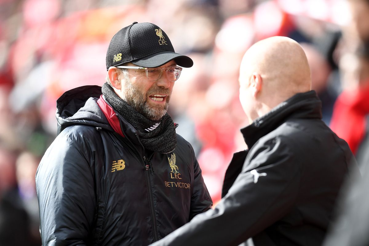 Jurgen Klopp, manager of Liverpool shakes hands with Sean Dyche, manager of Burnley