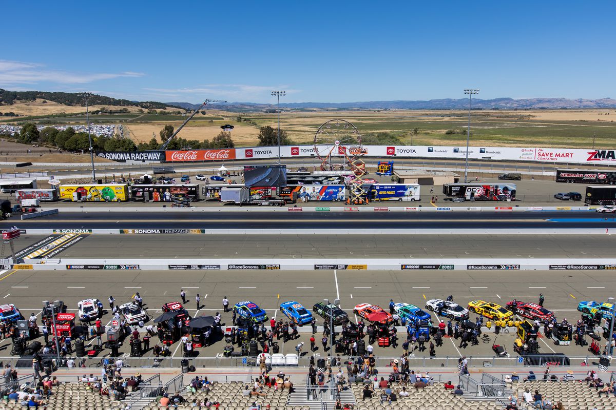 Cars are lined up in the pits in preparation for qualifying for the NASCAR Cup Series Toyota/Save Mart 350 on June 11, 2022 at Sonoma Raceway in Sonoma, CA.