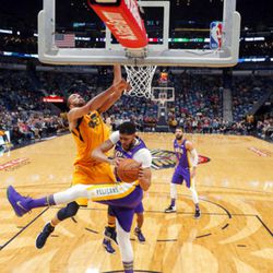 New Orleans Pelicans forward Anthony Davis and Utah Jazz center Rudy Gobert (27) battle under the basket in the first half of an NBA basketball game in New Orleans, Monday, Feb. 5, 2018. (AP Photo/Gerald Herbert)