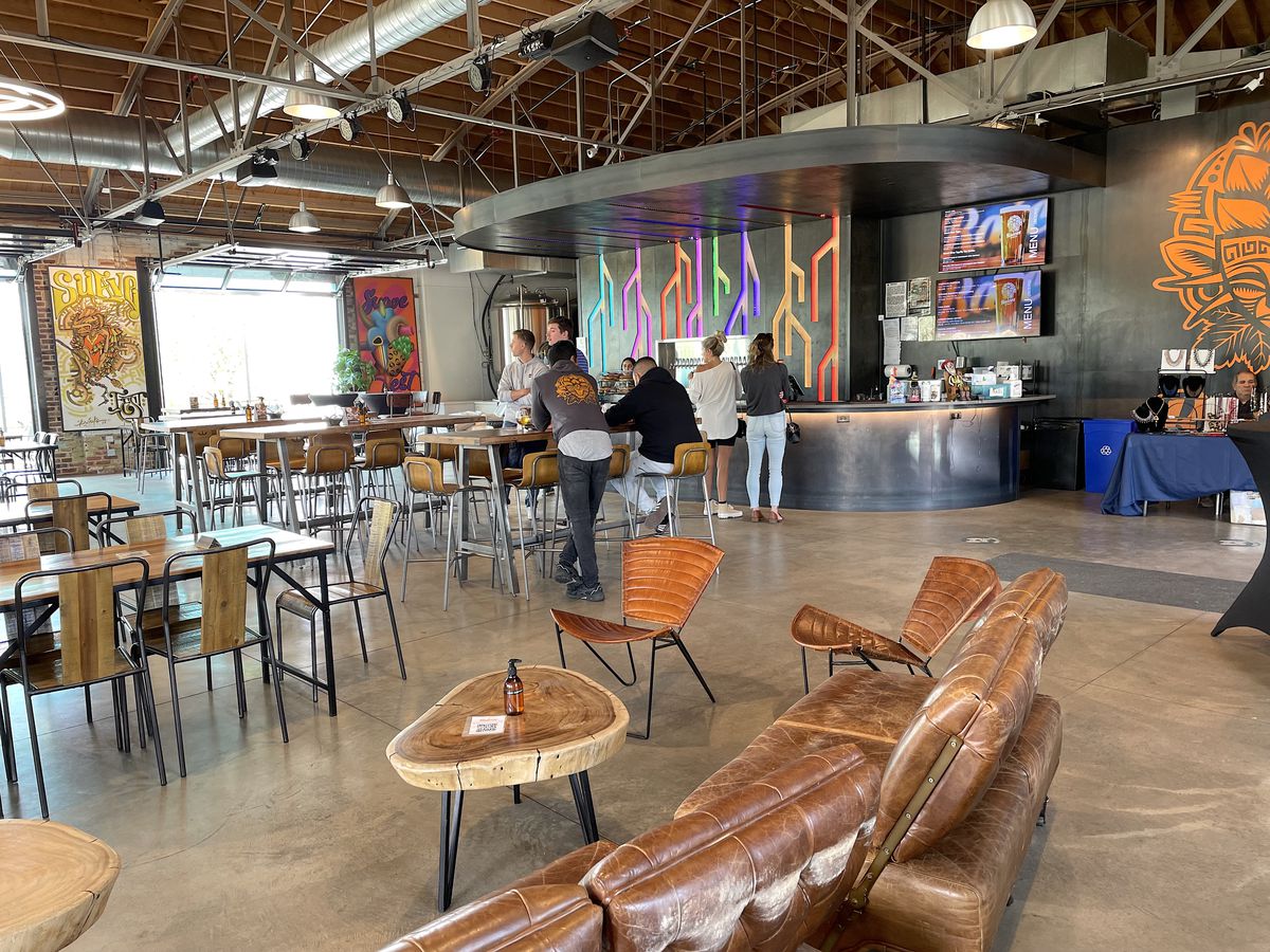 Chairs and tables in the interior of Raíces Brewing Company