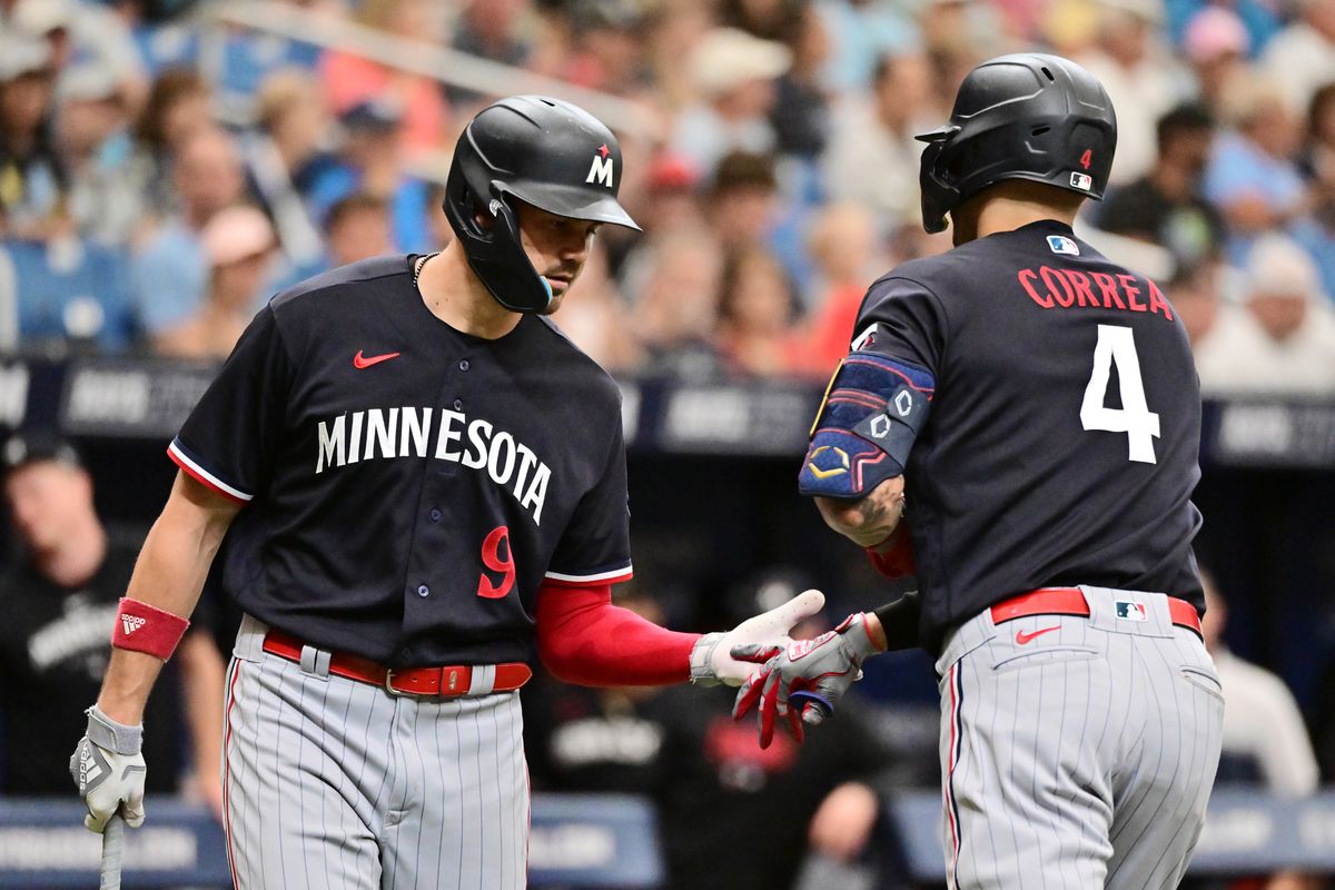 Carlos Correa of the Minnesota Twins celebrates with Trevor Larnach after hitting a home run in the fourth inning against the Tampa Bay Rays at Tropicana Field on June 08, 2023 in St Petersburg, Florida.