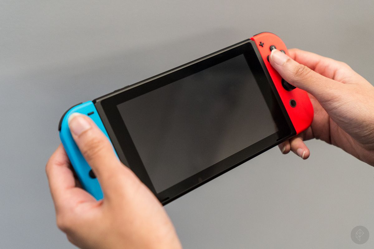 Nintendo Switch with Joy-Cons in hands
