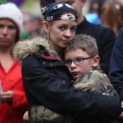 Cat Lichfield hugs her son Thomas Lichfield during a vigil for the victims and survivors of the mass shooting at a gay nightclub in Orlando, Florida, outside of the Salt Lake City-County Building on Monday, June 13, 2016.
