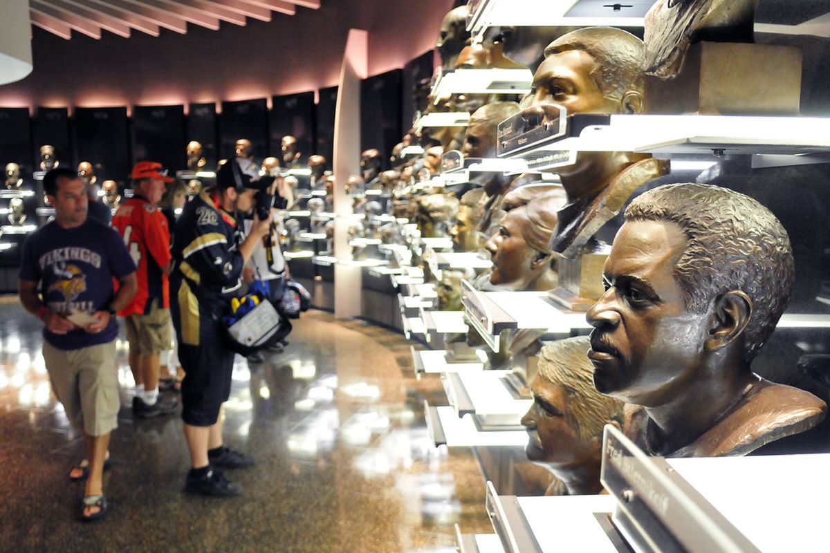 CANTON, OH - AUGUST 6:  Fans view the busts of former inductees prior to this year's induction ceremony at the Pro Football Hall of Fame on August 6, 2011 in Canton, Ohio.  (Photo by Jason Miller/Getty Images)